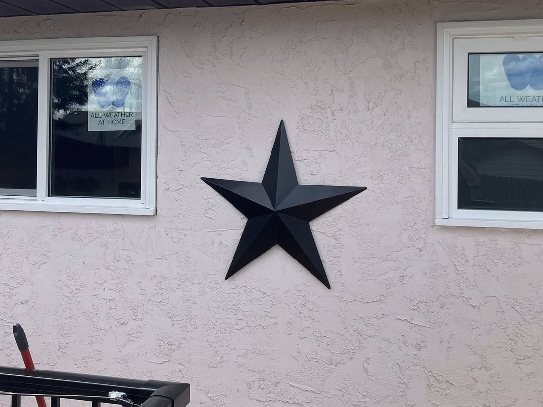 After: the same wall with crisp new white windows