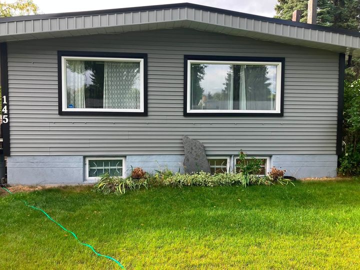 Front of the bungalow with the old basement windows