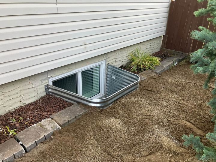 Galvanized window well around a new egress window