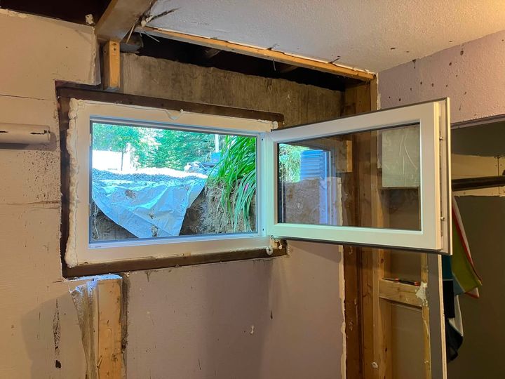 Egress window opened fully from inside the basement