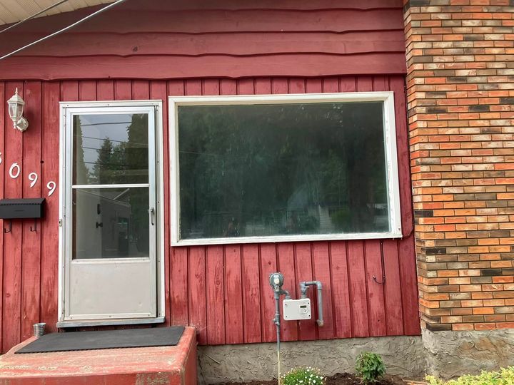 Before: Red-sided house with the old living room window