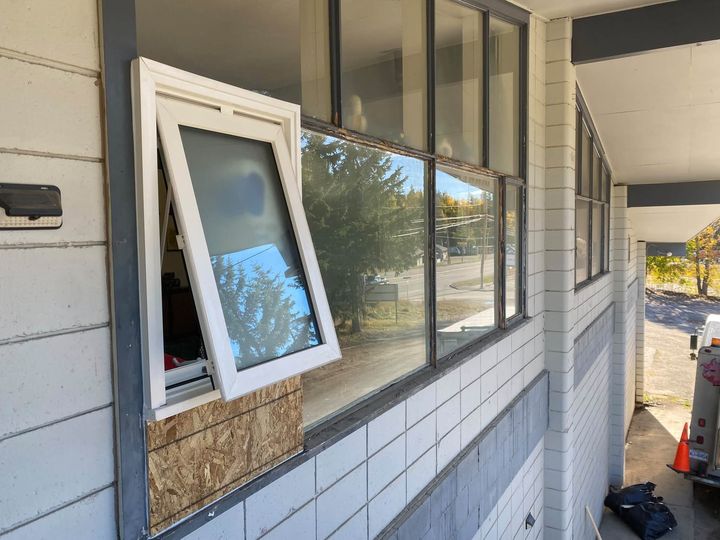 New white casement window opened in the row of windows