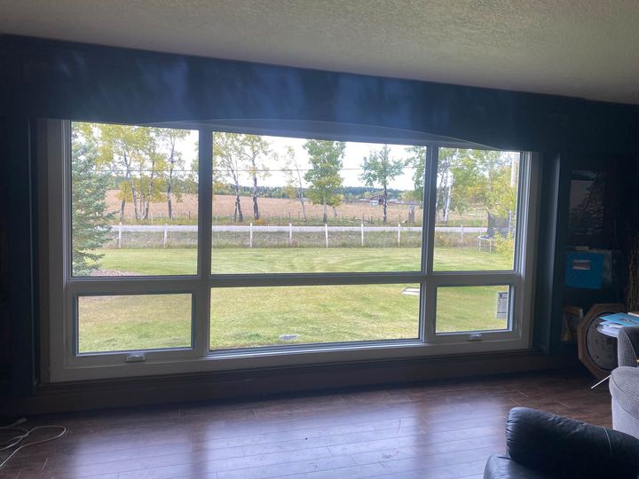 Huge new triple-pane picture window overlooking the yard