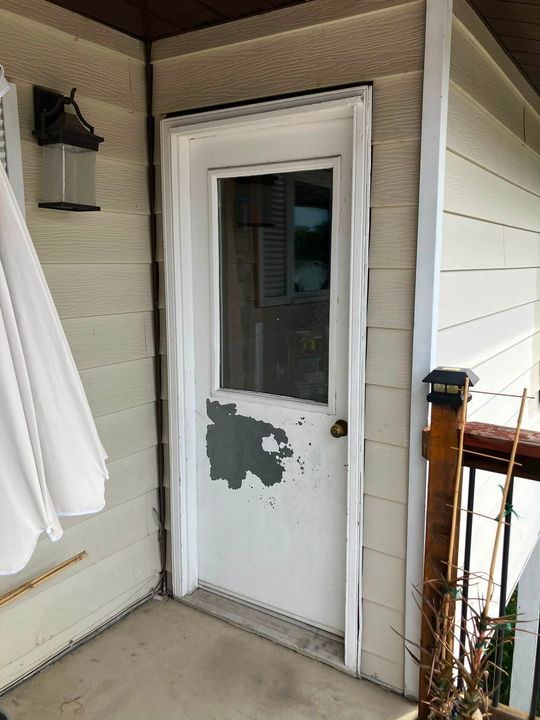 Before: Old half-lite back door with peeling paint